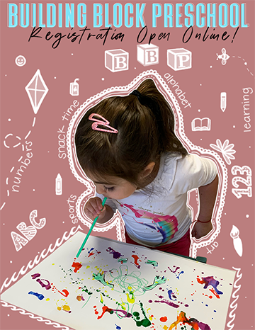 a young child painting with a brush