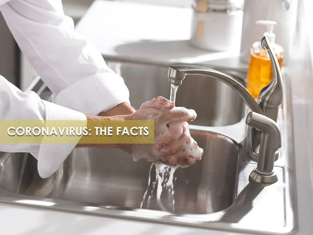 a person washing hands under running water