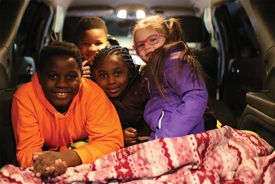 a group of children in a car