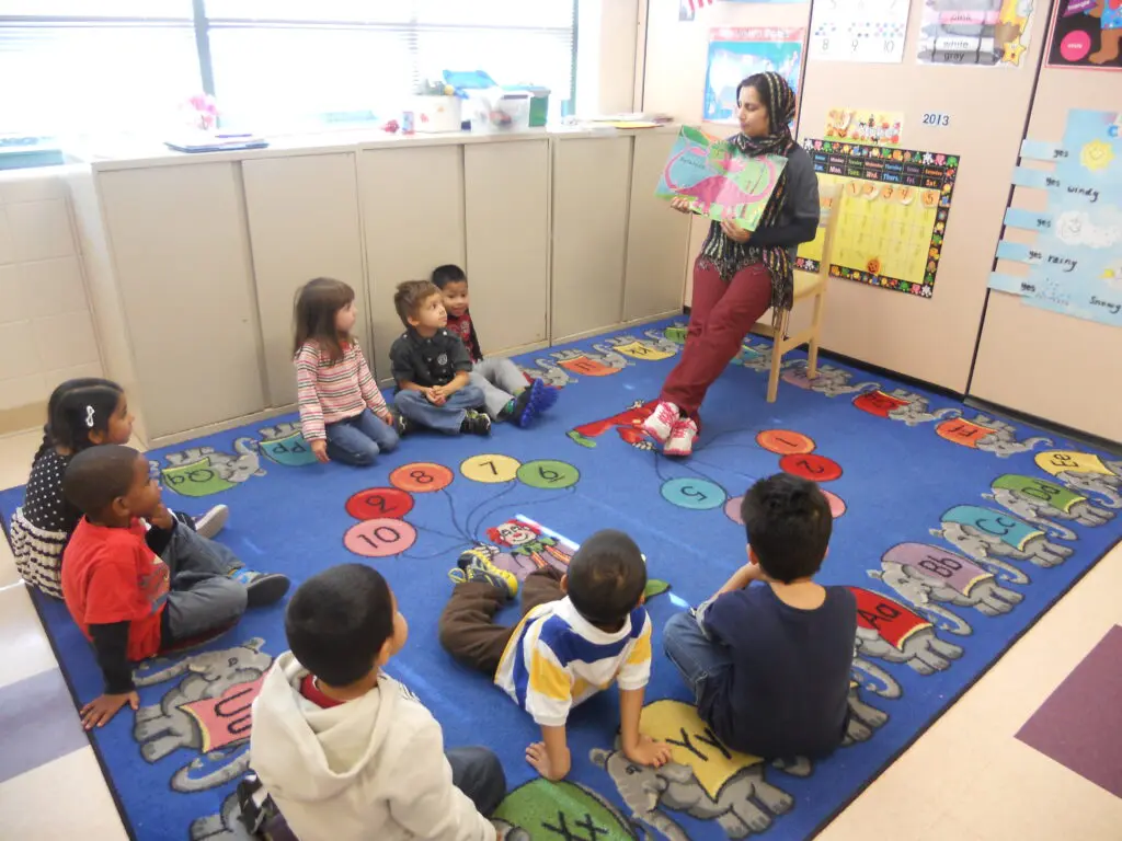 a person teaching children in a classroom