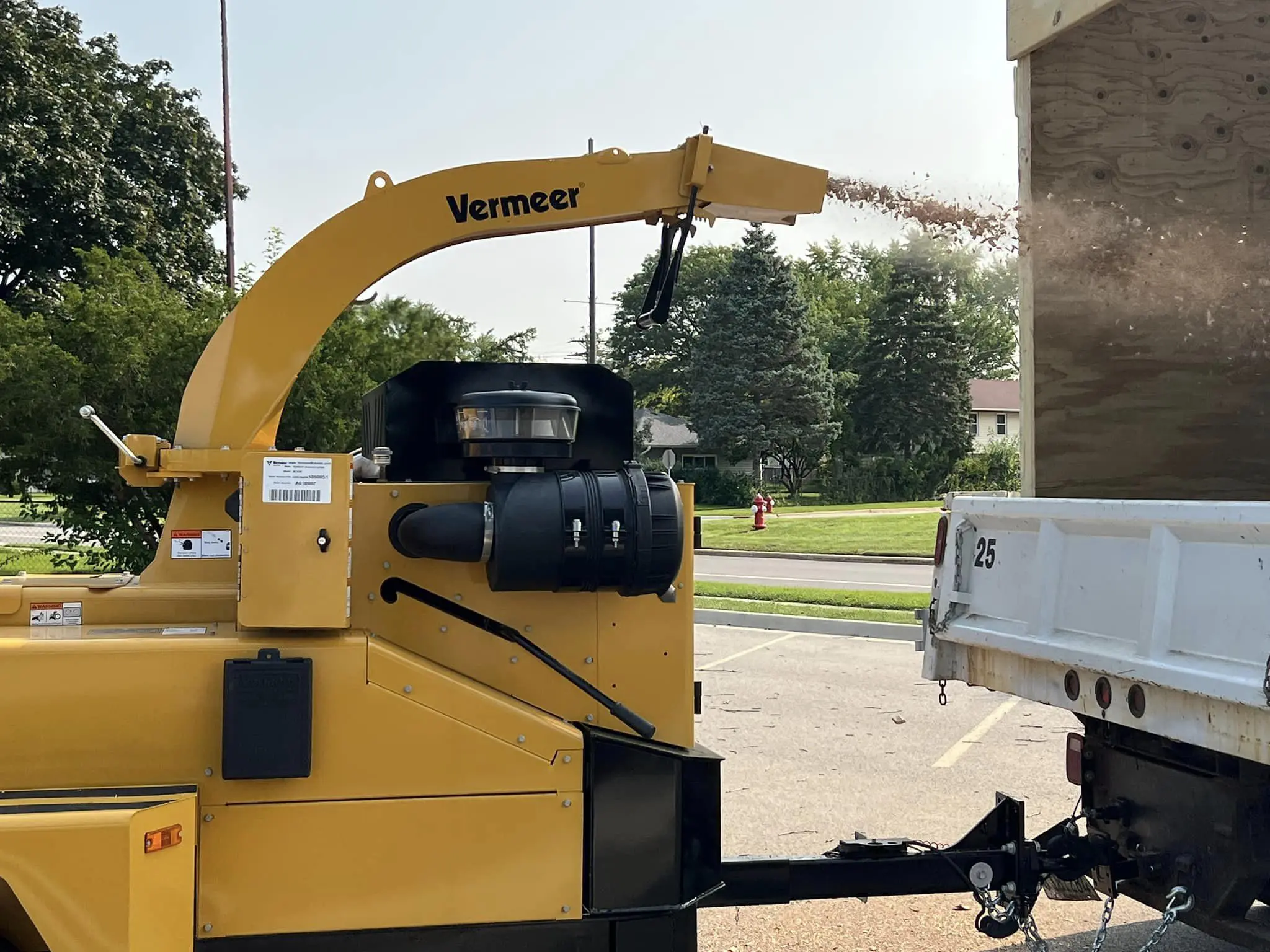 a machine with a crane and a truck
