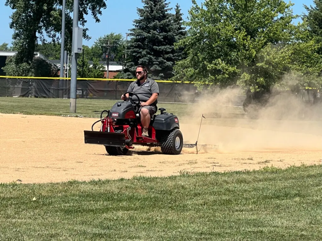 a person driving a tractor