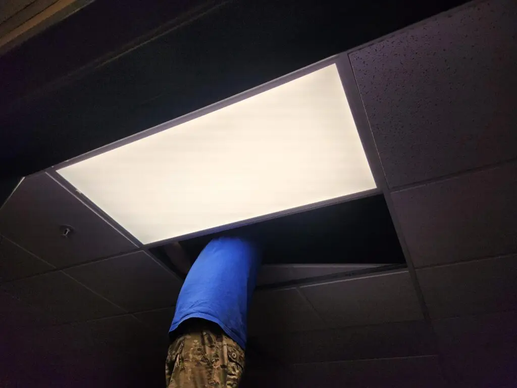 a person standing under a light
