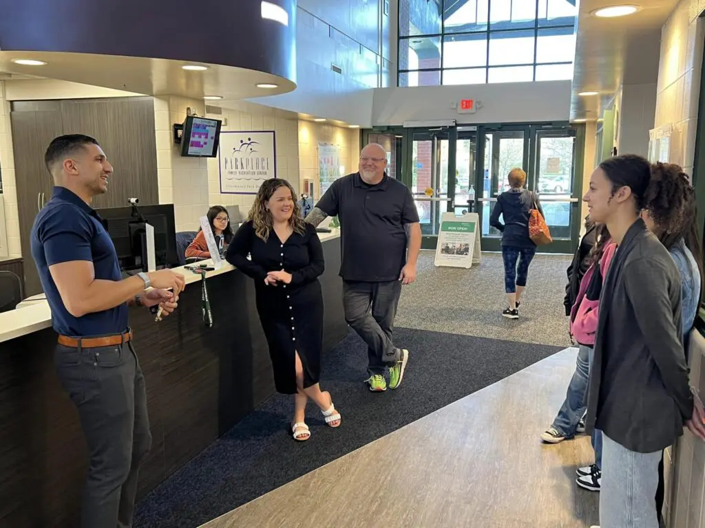 a group of people in a hallway