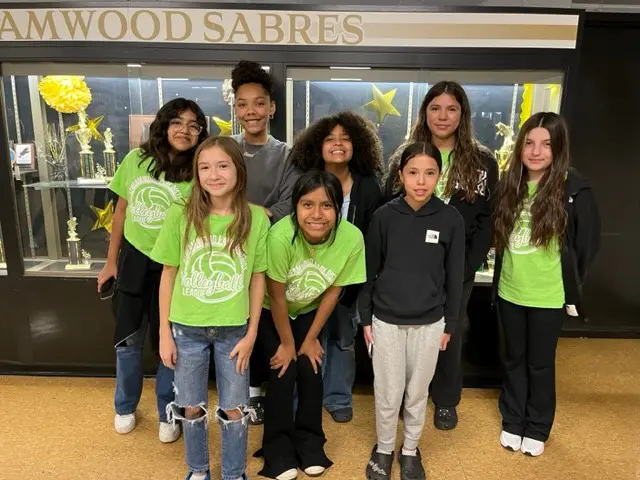 a group of childs posing for a photo