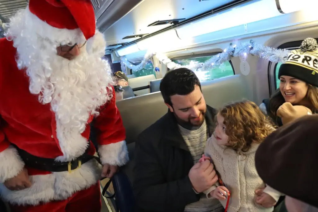 a person in a garment with a child and a person in a train