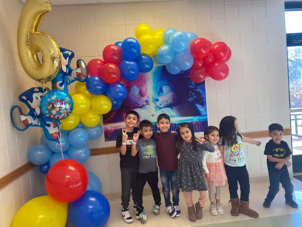 a group of kids posing for a photo