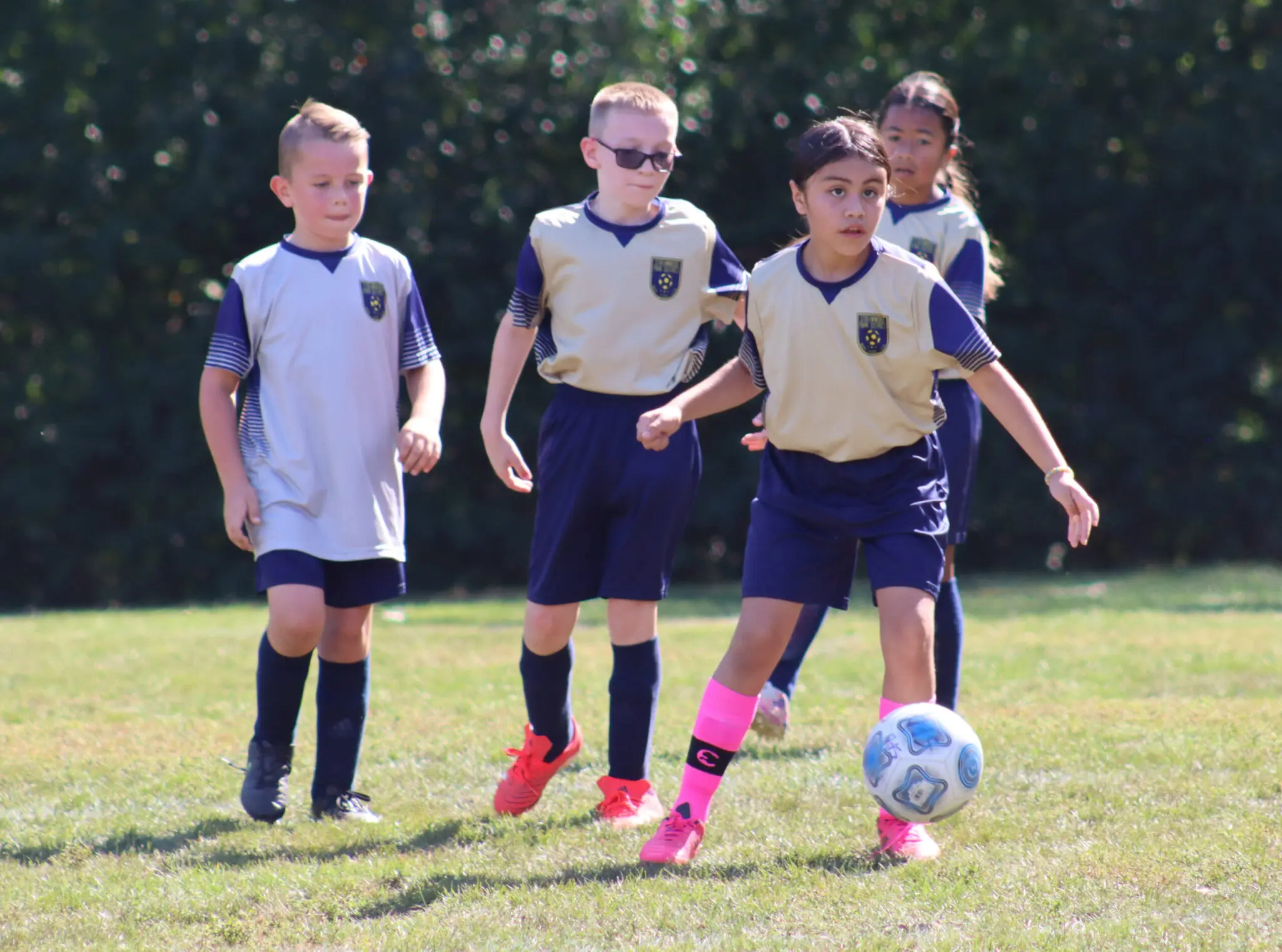a group of kids playing football