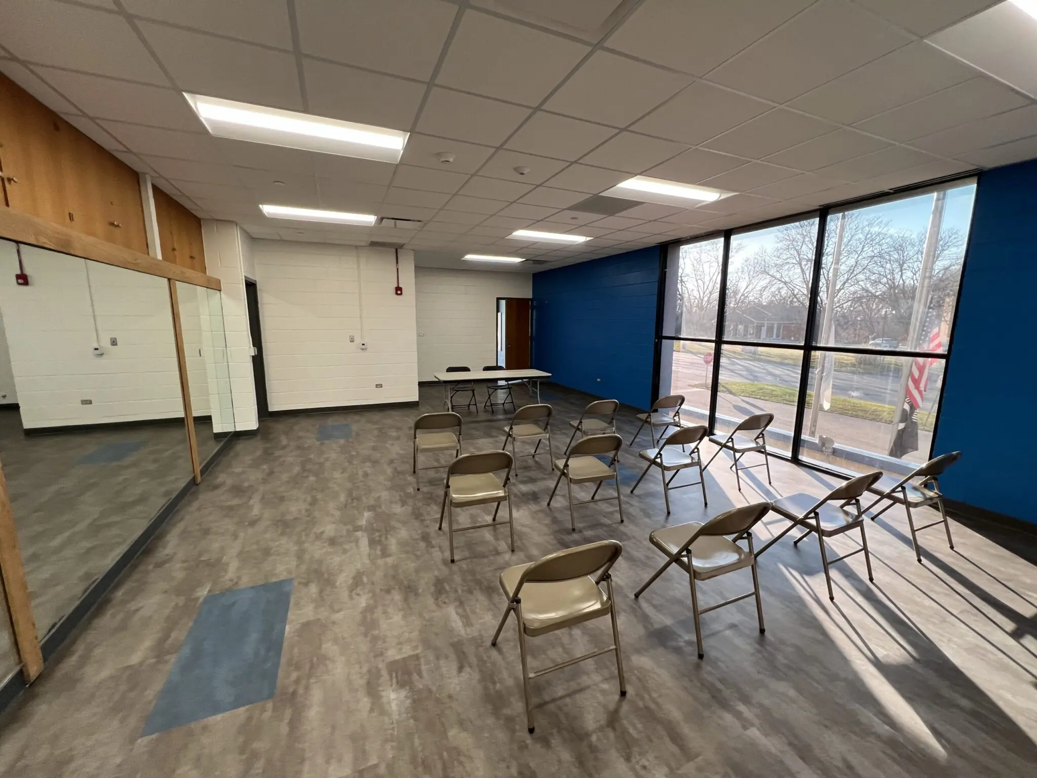 a room with chairs and tables