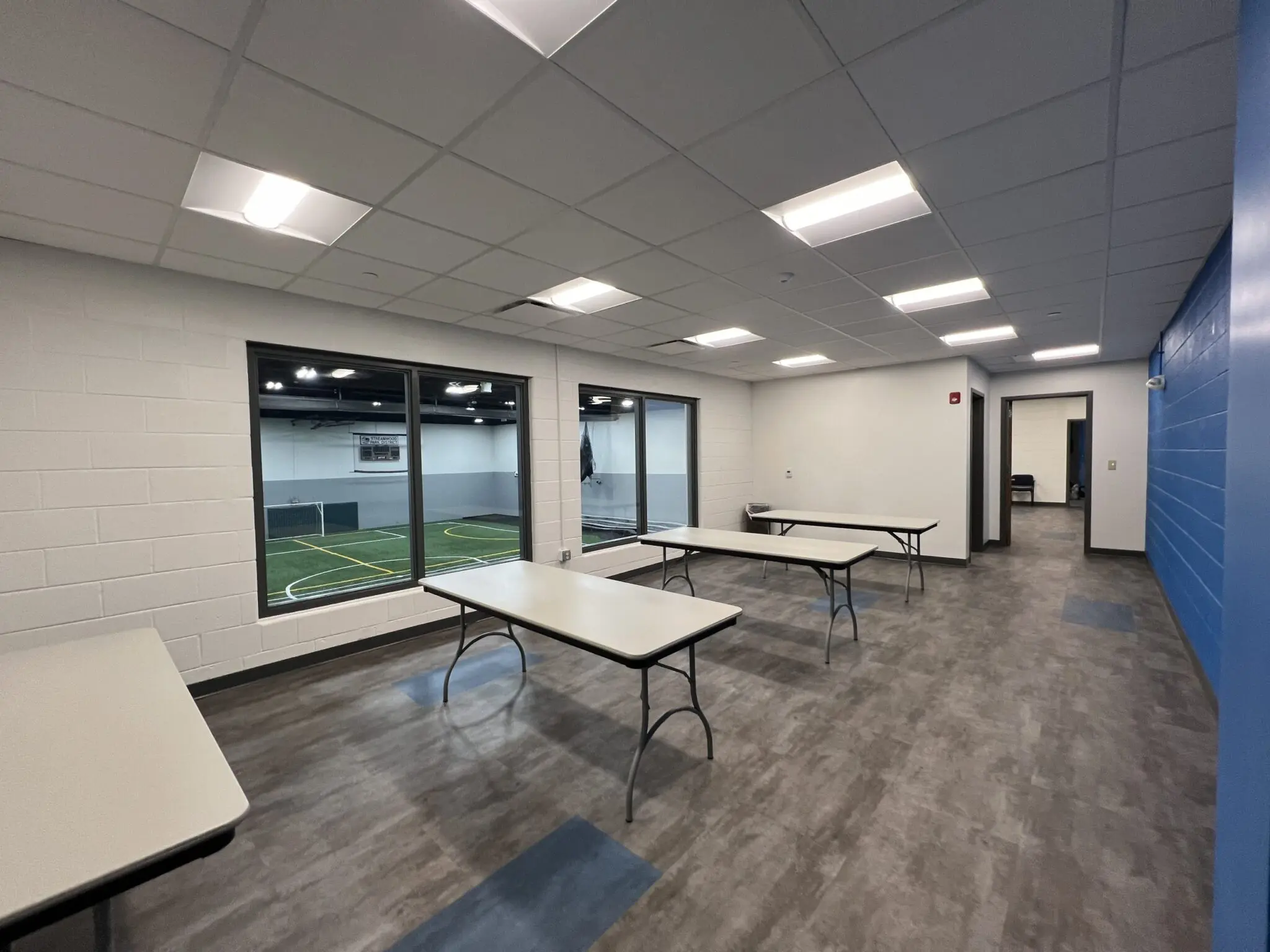 a room with tables and windows