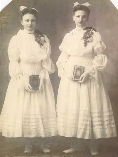 a couple of women in white dresses