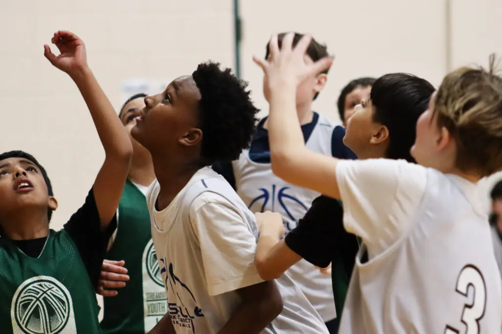 a group of kids in a gym