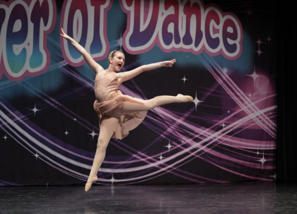 a child dancing on stage