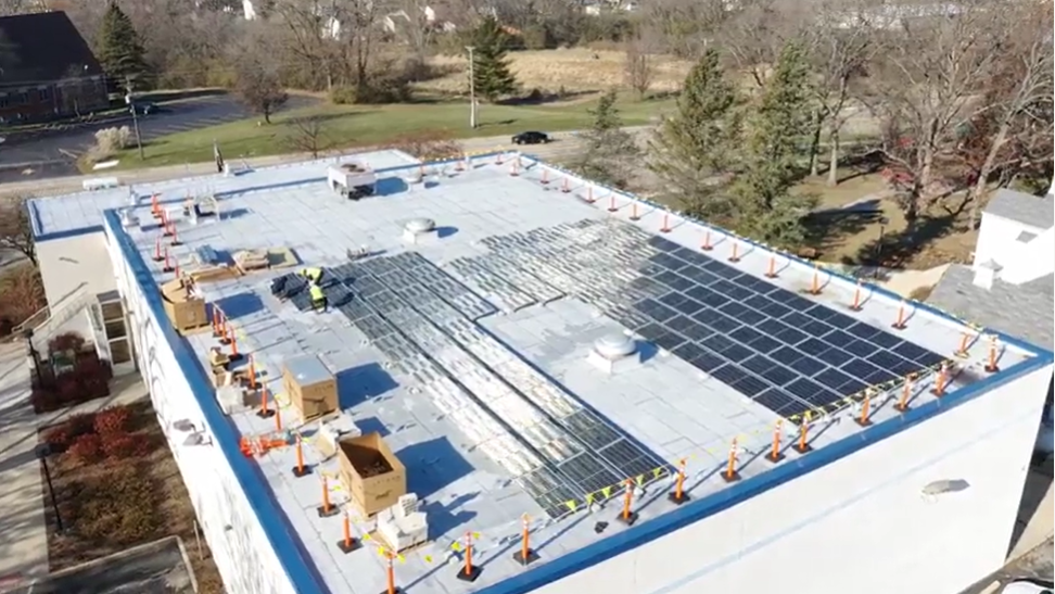 a roof of a building with solar panels
