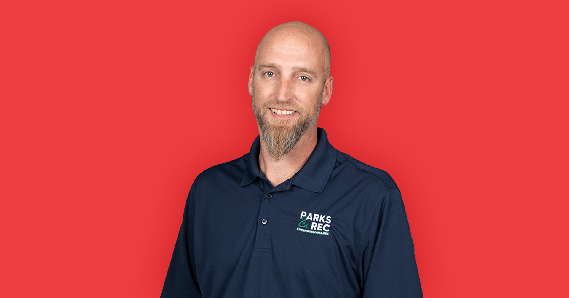 man with beard on a red background