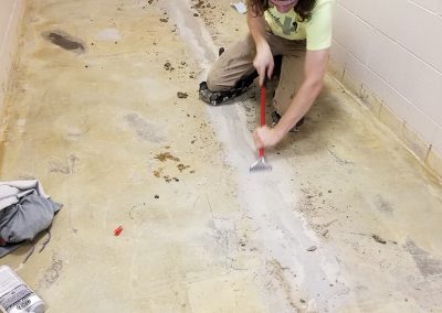 man removing flooring
